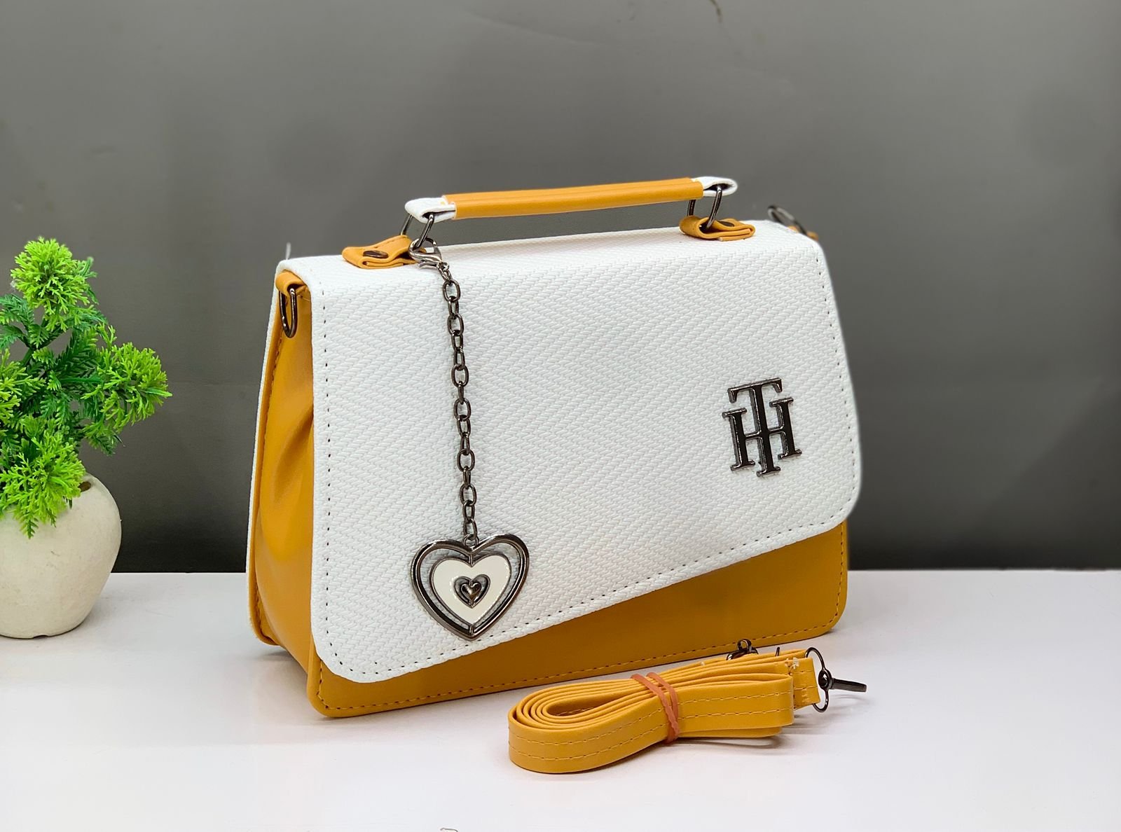 Stylish Women's White & Black Structured Handbag with Heart Charm